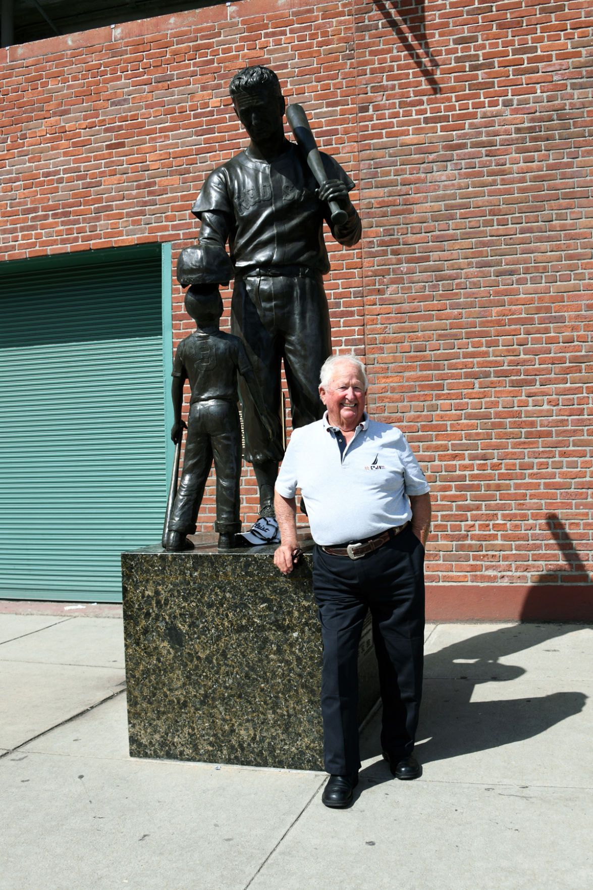 173 Glen Anderson posed with statue of Ted Williams who is considered a hero of baseball and a champion of children..jpg